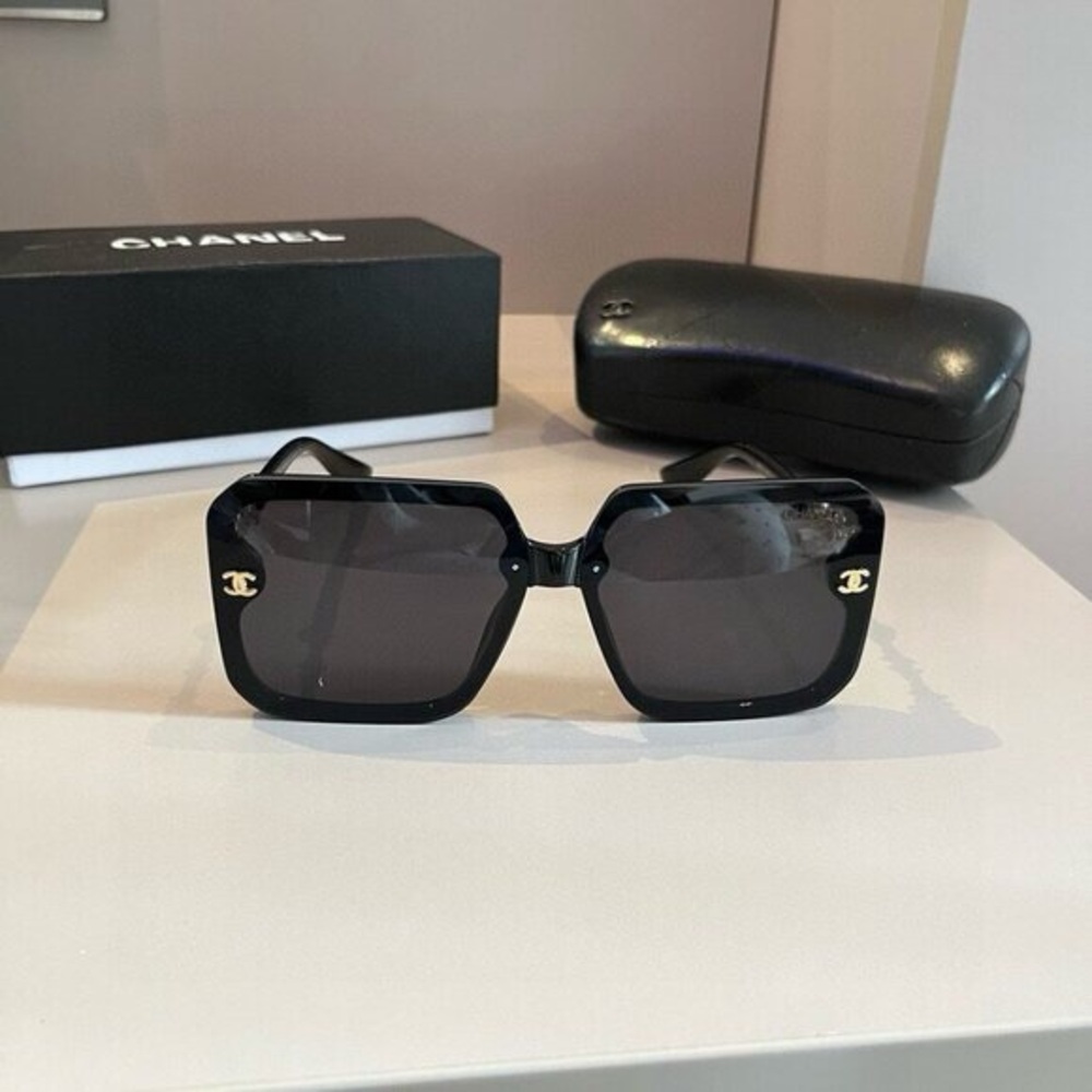 CHANEL Black Geometric Sunglasses with Glossy Finish